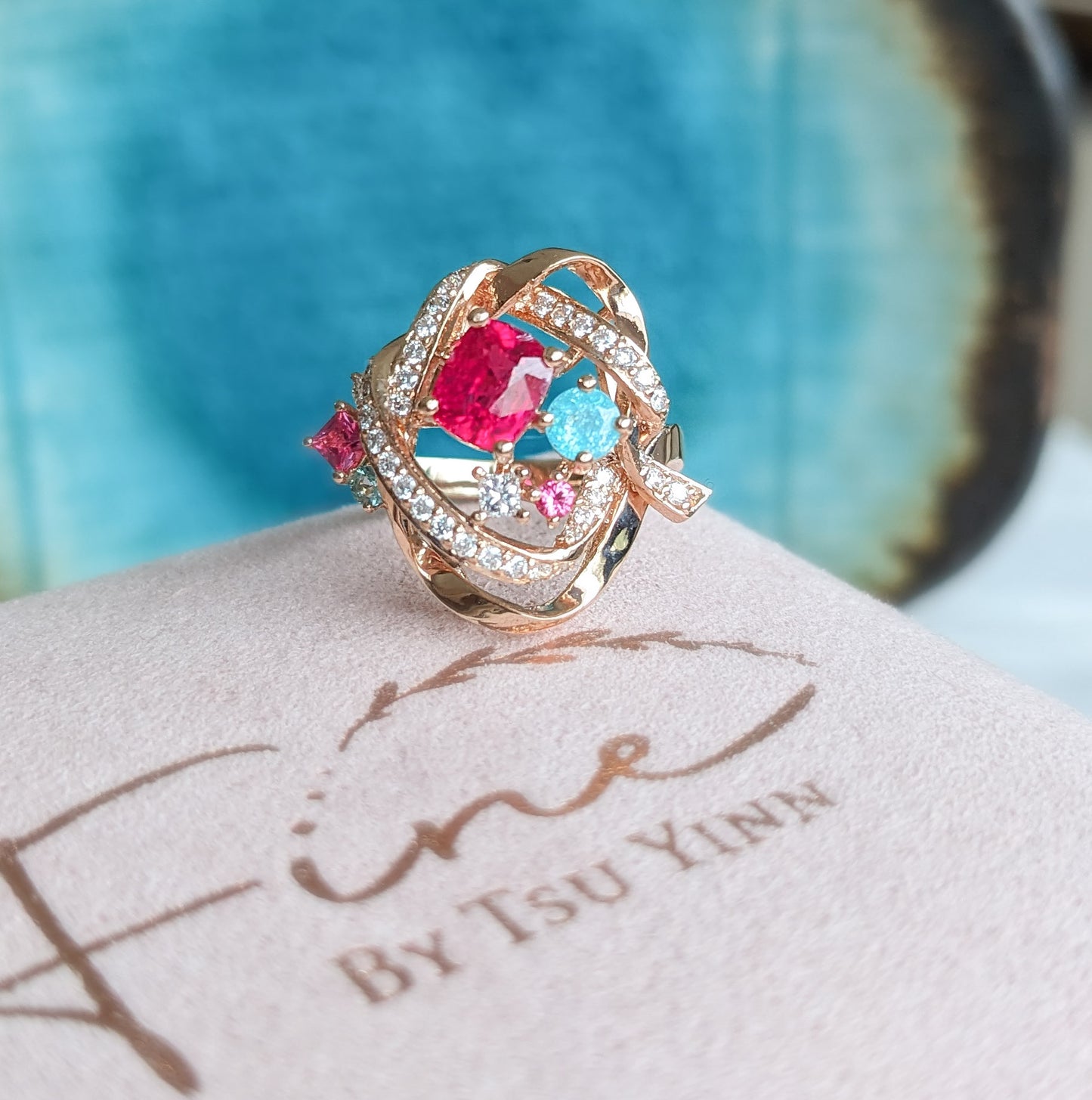 RG Mogok Pink Spinel and Paraiba Tourmaline Interlocking Ribbons Ring