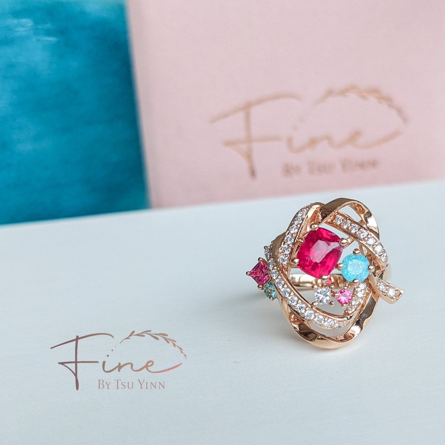 RG Mogok Pink Spinel and Paraiba Tourmaline Interlocking Ribbons Ring