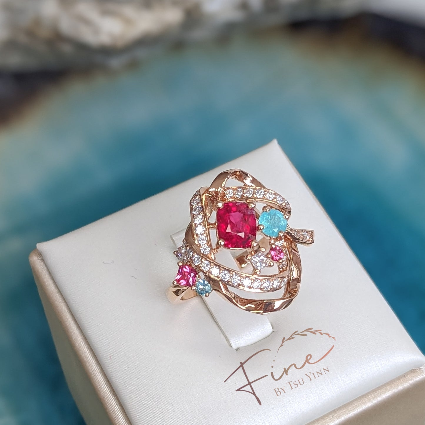 RG Mogok Pink Spinel and Paraiba Tourmaline Interlocking Ribbons Ring