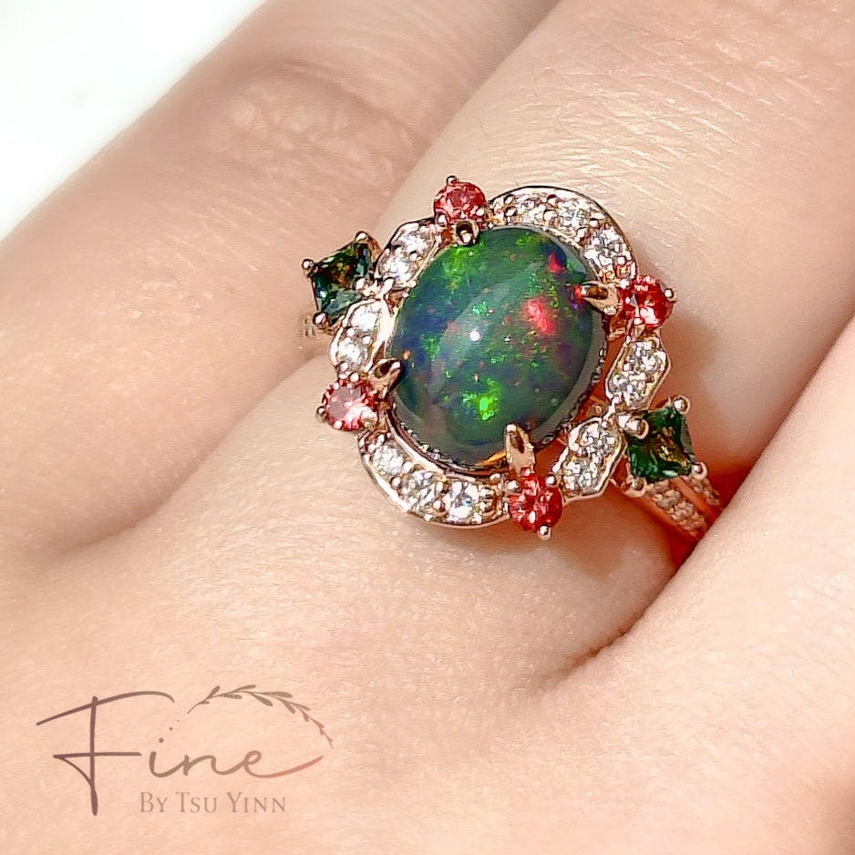 FBTY Kyra Ring with Black Opal Cabochon, Green Sapphires, Dark Orange Spinels and White Diamonds
