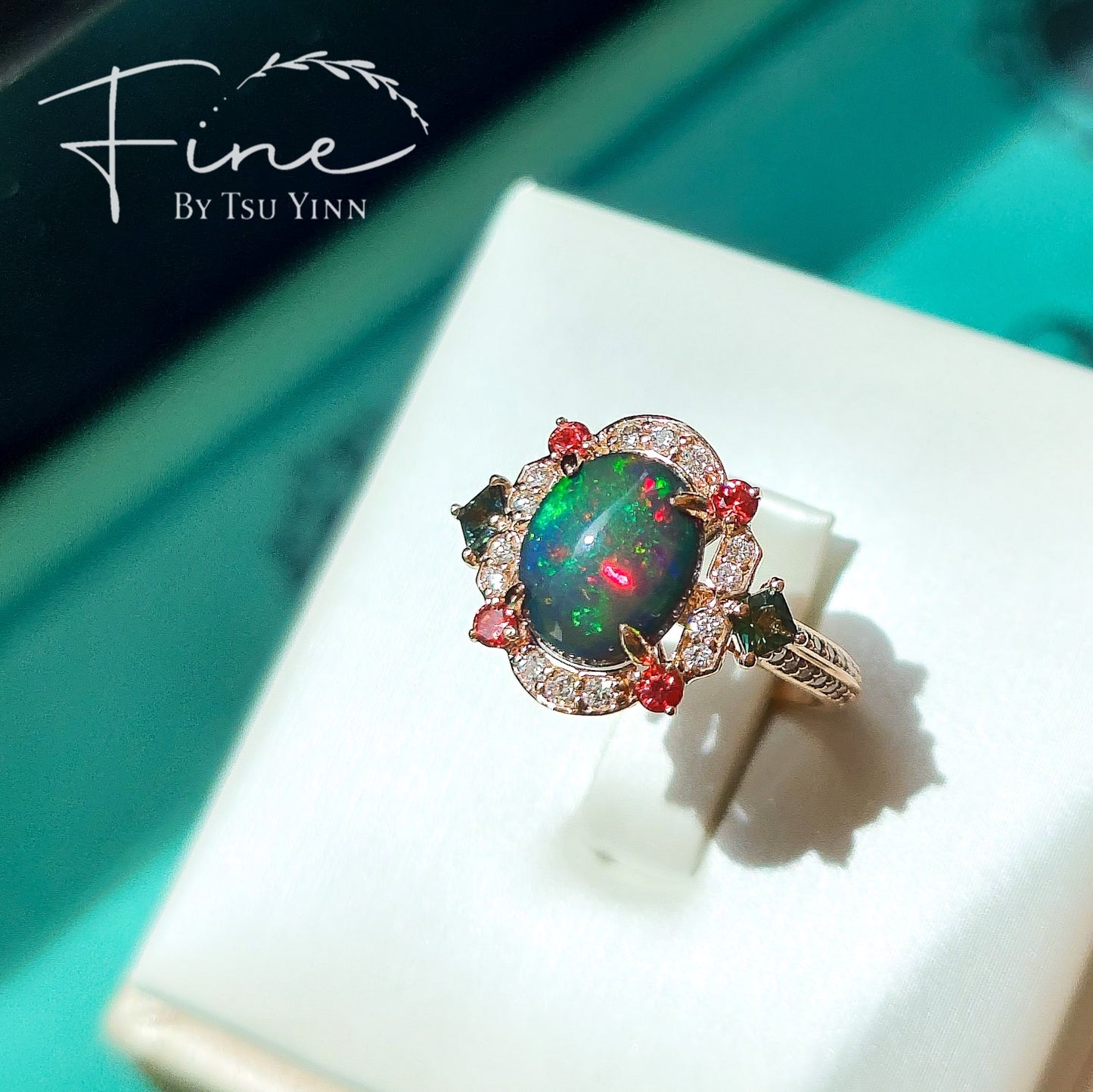 FBTY Kyra Ring with Black Opal Cabochon, Green Sapphires, Dark Orange Spinels and White Diamonds